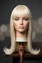 New Mistress 20-Inch Platinum Blonde Synthetic Wig with Bangs & Flipped Ends