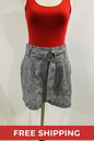 Black and white checkered shorts on a mannequin against a plain background